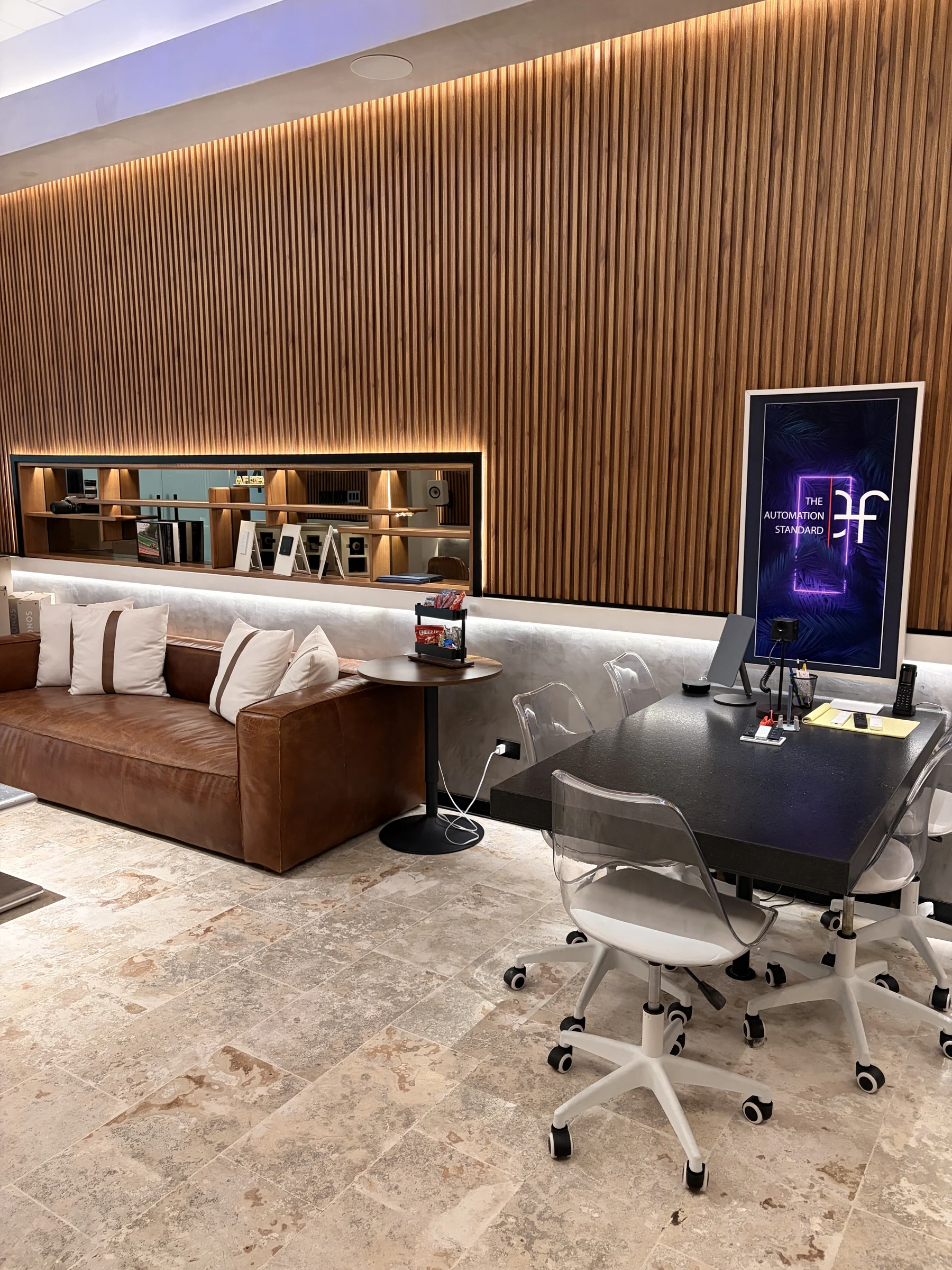 AF DEVS reception, orange timber presentation wall and work desk