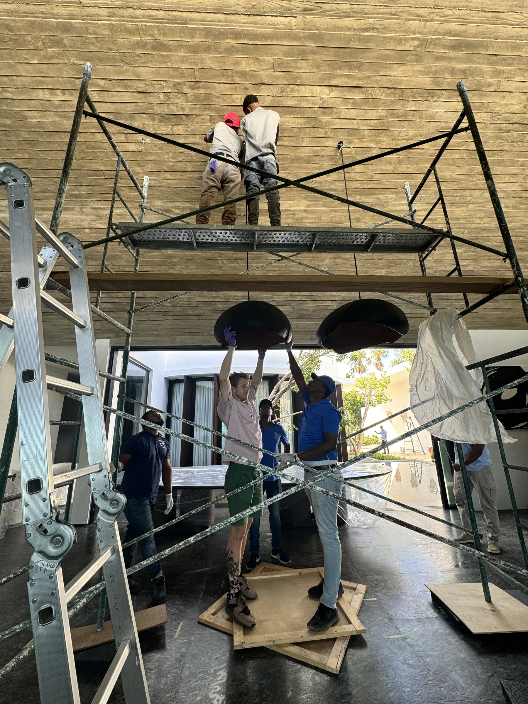 AF DEVS installers working on a villa interior ceiling